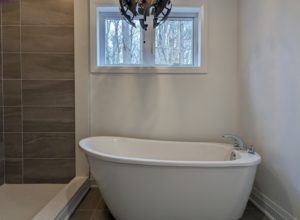 Primary suite includes  ensuite with large shower & soaker tub + walk-in closet