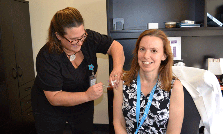CEO Gail Hunt getting flu shot
